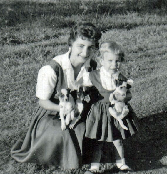 Holding puppies with my mom, taken at my grandmother's house.
