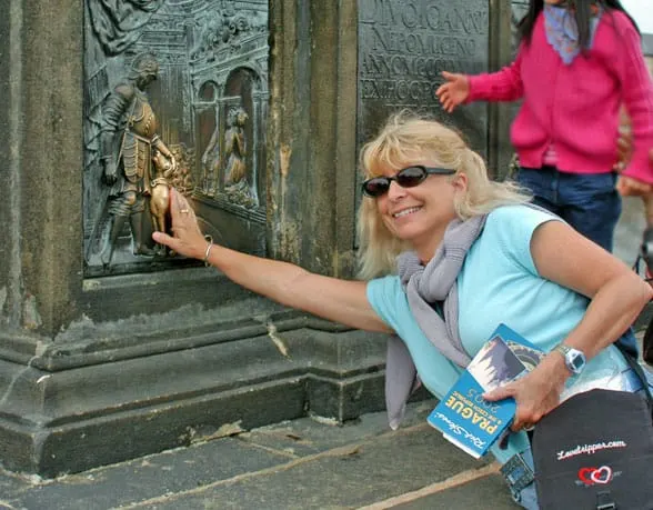 photo of author and dog plaque on Charles Bridge in Prague, Czech Republic
