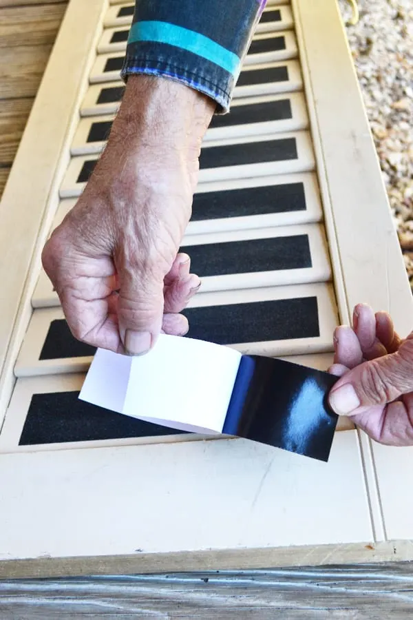 applying grip tape to shutter to create dog ramp