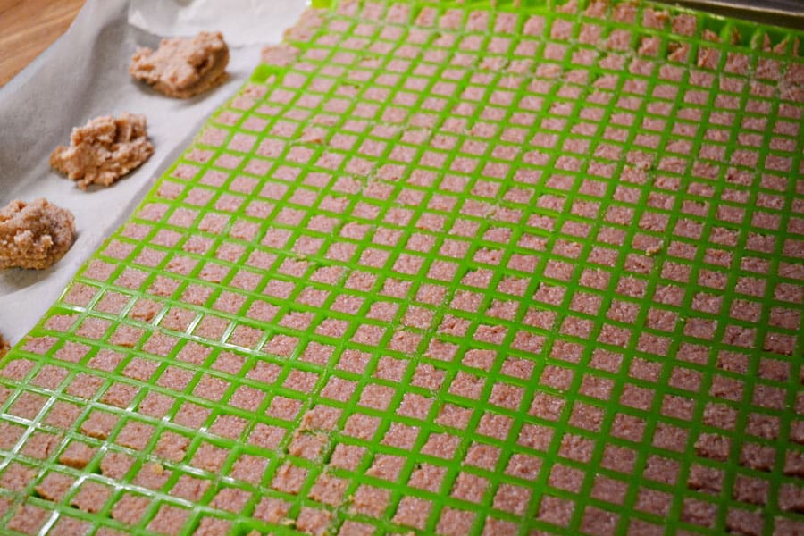 cookie sheet with pyramid mat filled with uncooked baby food training treats for dogs