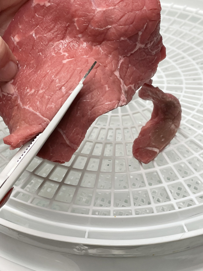 preparing steak for dog treats